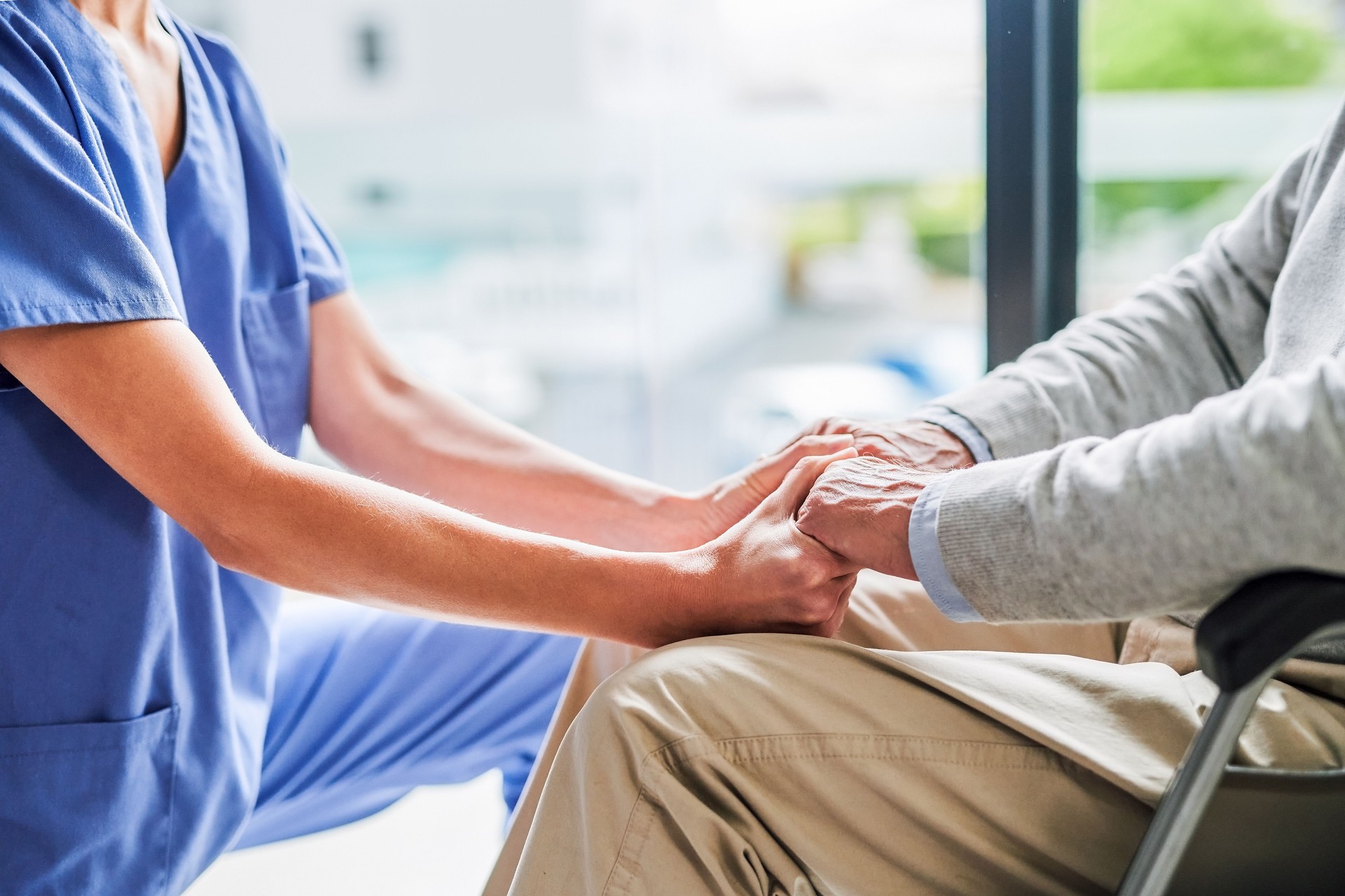 Shot of an unrecognizable doctor comforting a patient at a clinic